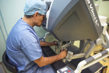 The surgeon in the robotic console